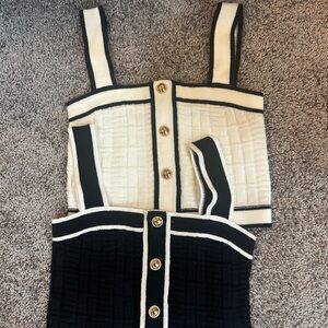 Stylish Black and Cream Knit Top with Gold Buttons